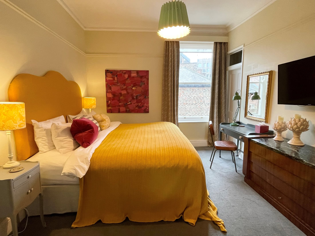 Yellow bedroom at The Parisi Townhouse York UK